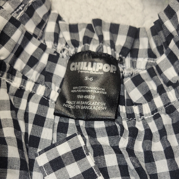 Charming Black and White Checkered Romper with Floral Detail - Picture 2 of 5